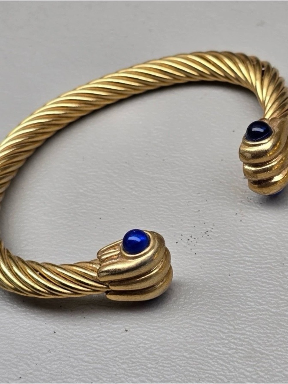 Gold-Tone Twisted Cuff Bracelet with Blue Cabochon Accents